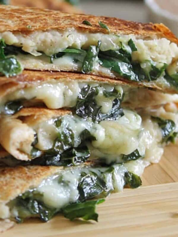 A stack of quesadillas with spinach and cheese.