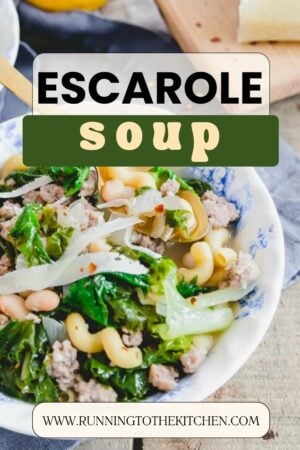 Escarole soup in a bowl with parmesan cheese.