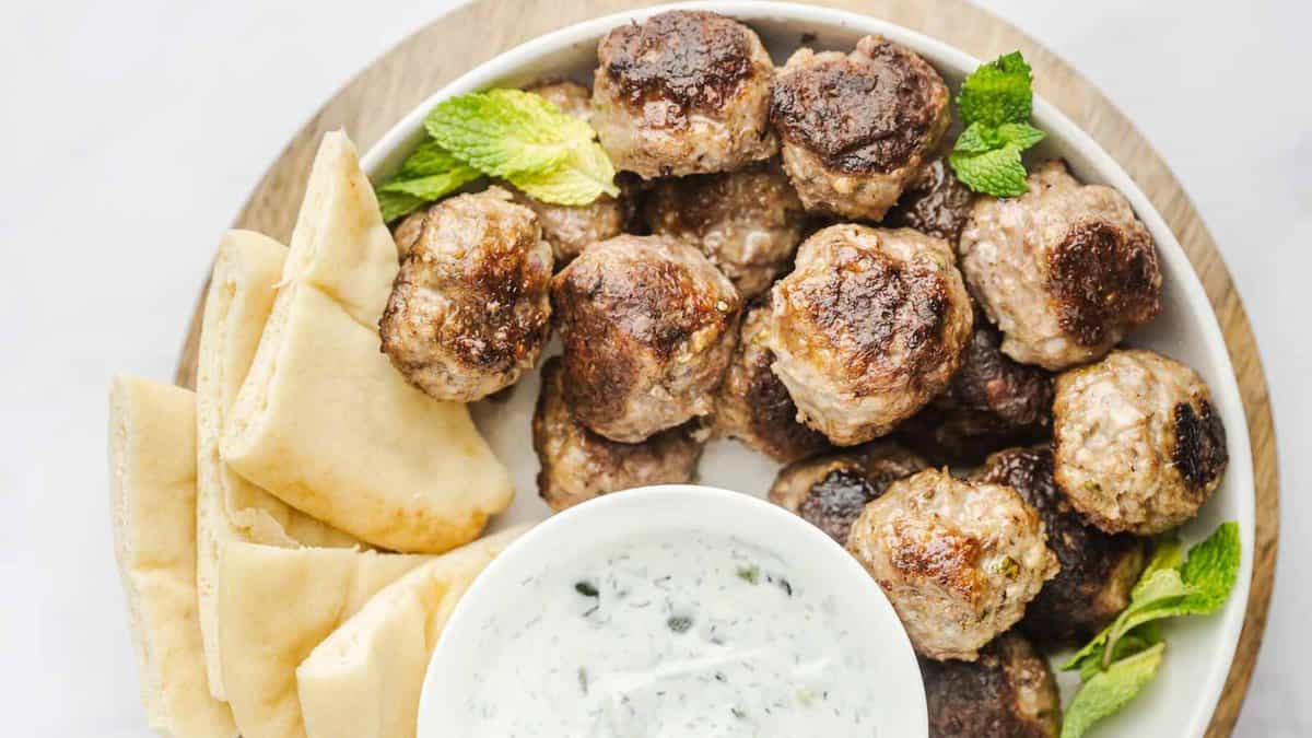 Gyro meatballs with tzatziki sauce and pita bread.