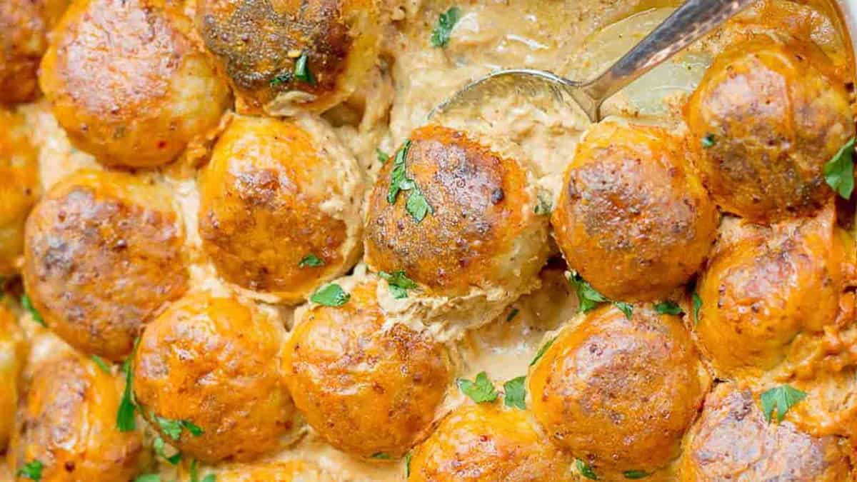A casserole dish with mashed potatoes and gravy.