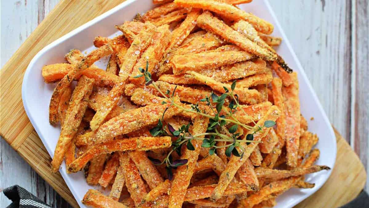 Carrot fries on a white plate.