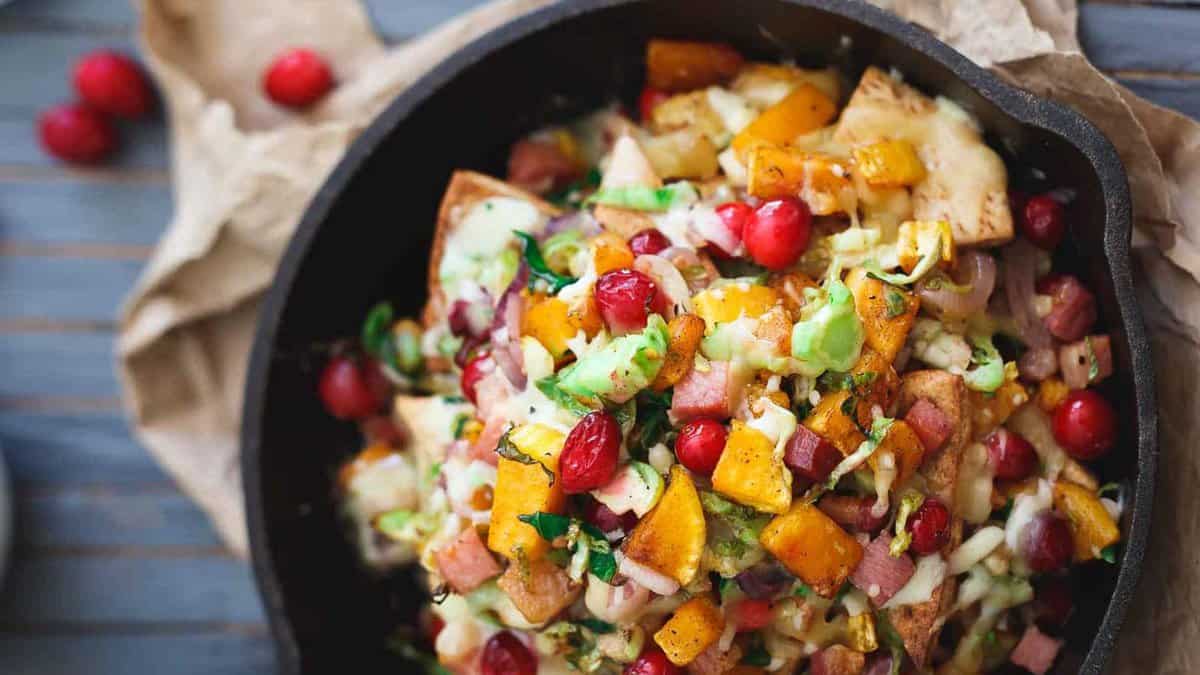 A skillet filled with cranberry and ham quesadilla.
