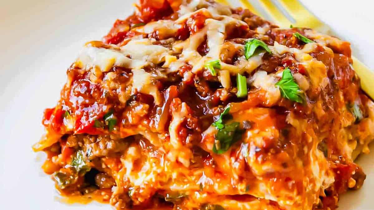 Lasagna on a plate with a fork.