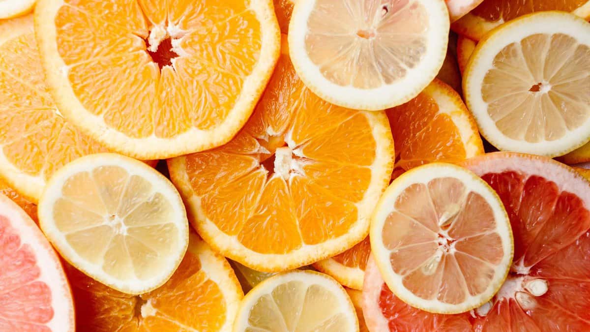A close up of sliced oranges and lemons.