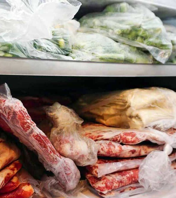 A refrigerator full of meat in plastic bags.