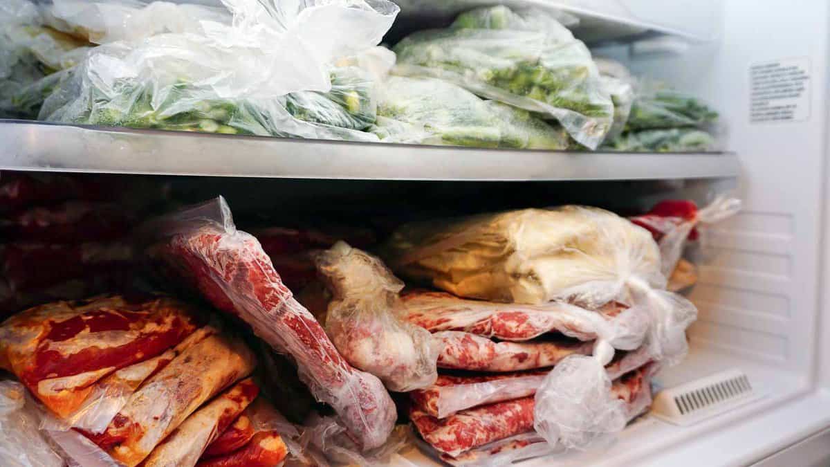A refrigerator full of meat in plastic bags.
