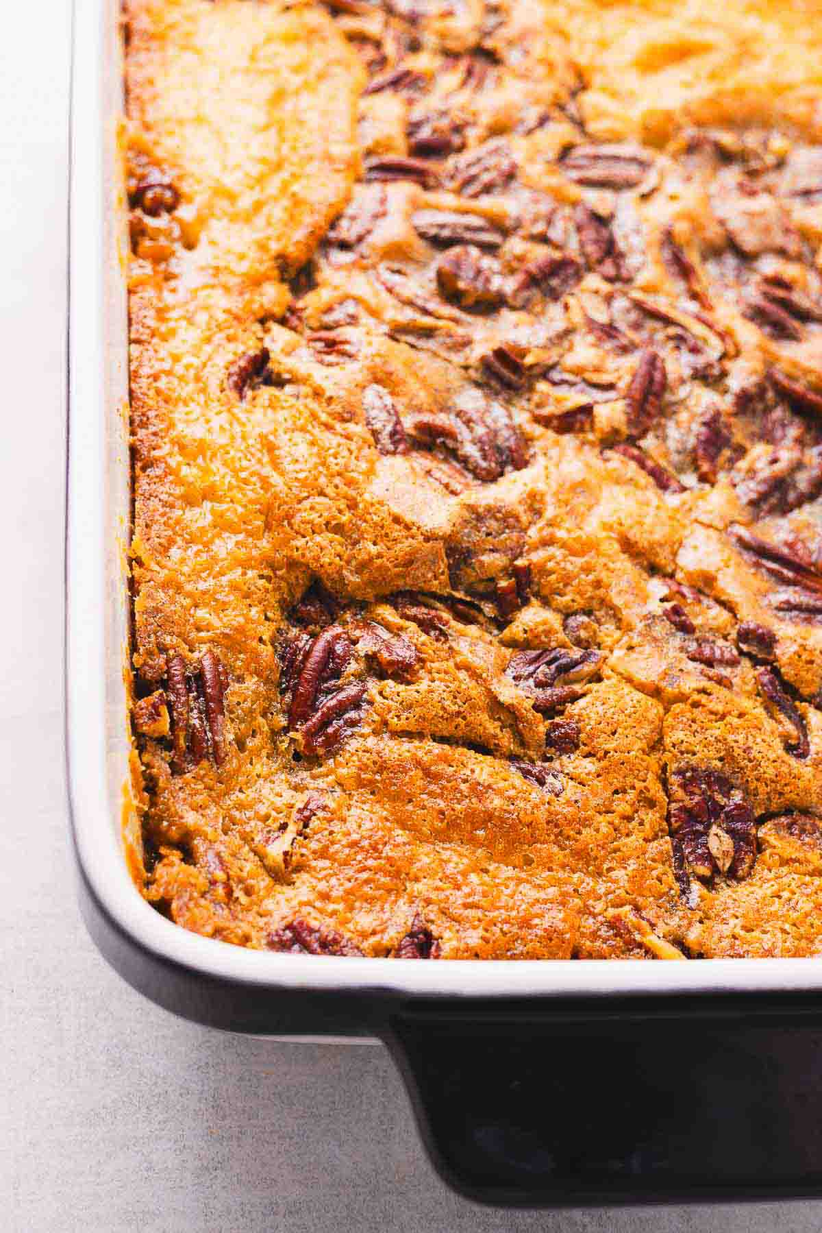 A baking dish with a pecan cobbler in it.