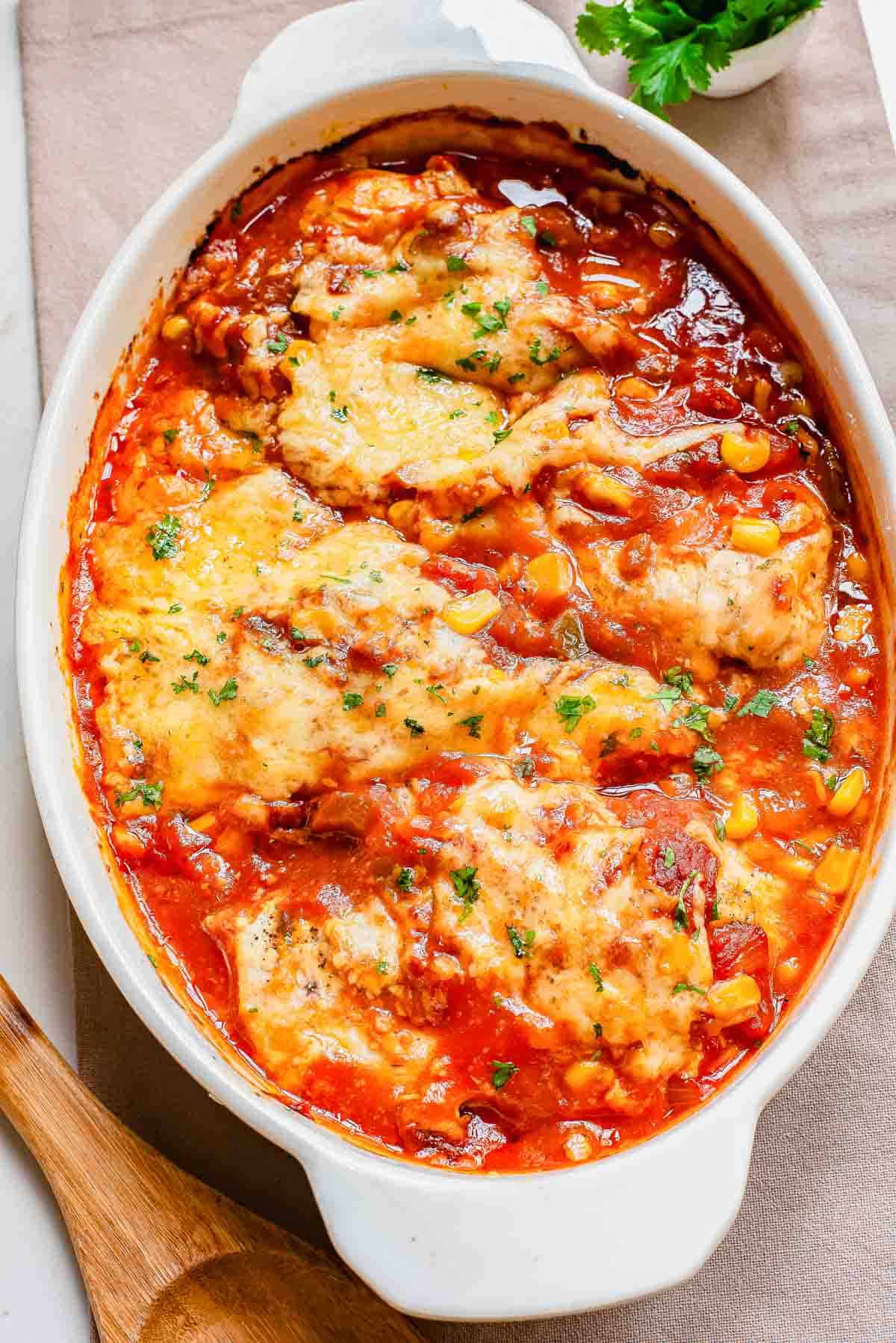 A casserole dish with cheesy salsa chicken.