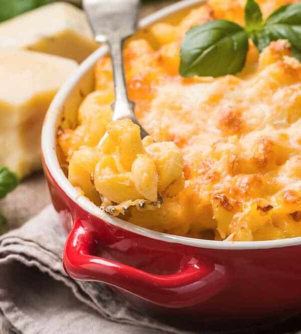 Macaroni and cheese in a red bowl.