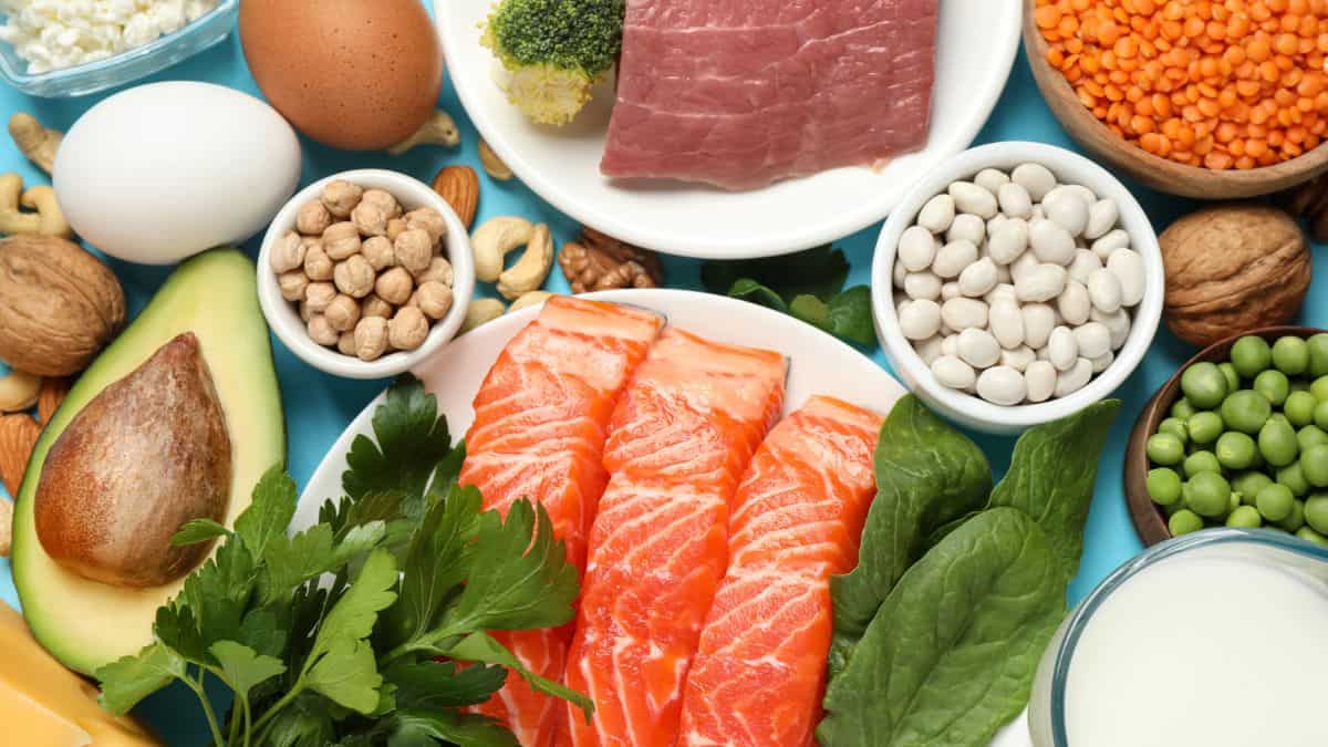 A variety of foods including salmon, eggs, nuts and beans.