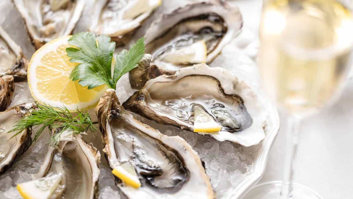 Oysters on ice with a glass of champagne.