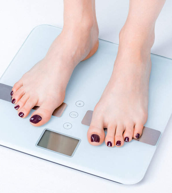 A person's feet on a scale.