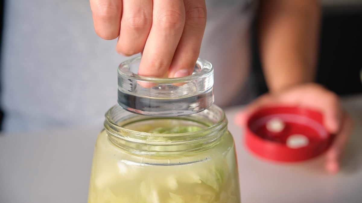 Opening a jar of pickles.