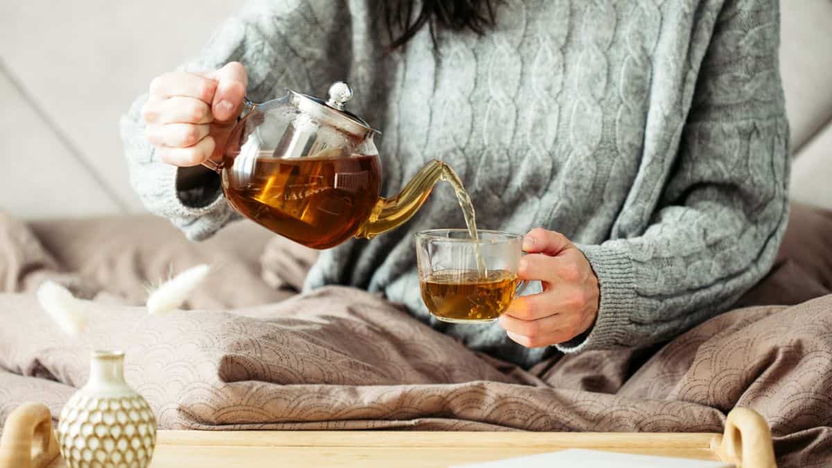 Woman drinking hot tea.