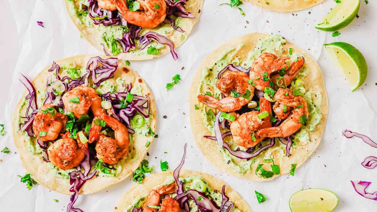 Spicy shrimp tostadas on a cutting board.