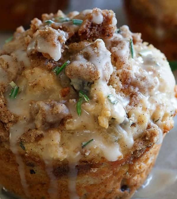 Christmas muffins with a streusel topping and garnished with rosemary.