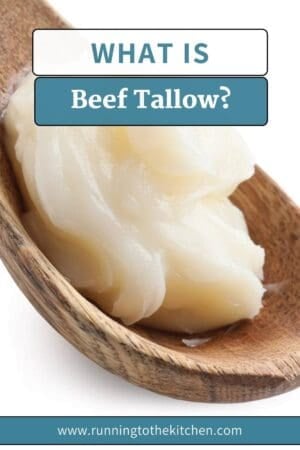a spoon full of tallow oil on a white background