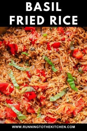 Close-up of basil fried rice with red bell peppers, onions, and fresh basil strips, all mixed with seasoned rice. Text at the top reads "Basil Fried Rice" and a website URL appears at the bottom.