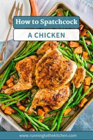 A perfectly roasted spatchcock chicken sits on a baking sheet with green beans and sweet potato cubes, featuring the text "How to Spatchcock a Chicken" and the website "runningtothekitchen.com" at the bottom.