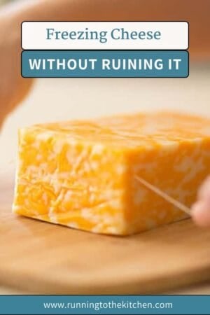 A close-up of hands slicing a block of marbled cheese with dental floss on a wooden cutting board. Text above reads "Freezing Cheese Without Ruining It: how to freeze cheese." Website "www.runningtothekitchen.com" is at the bottom.