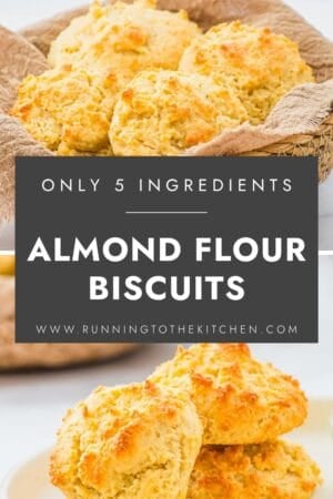 Golden almond flour biscuits are stacked in a rustic basket and on a white plate. Text overlay reads: “Only 5 ingredients. Almond flour biscuits. www.runningtothekitchen.com.”.